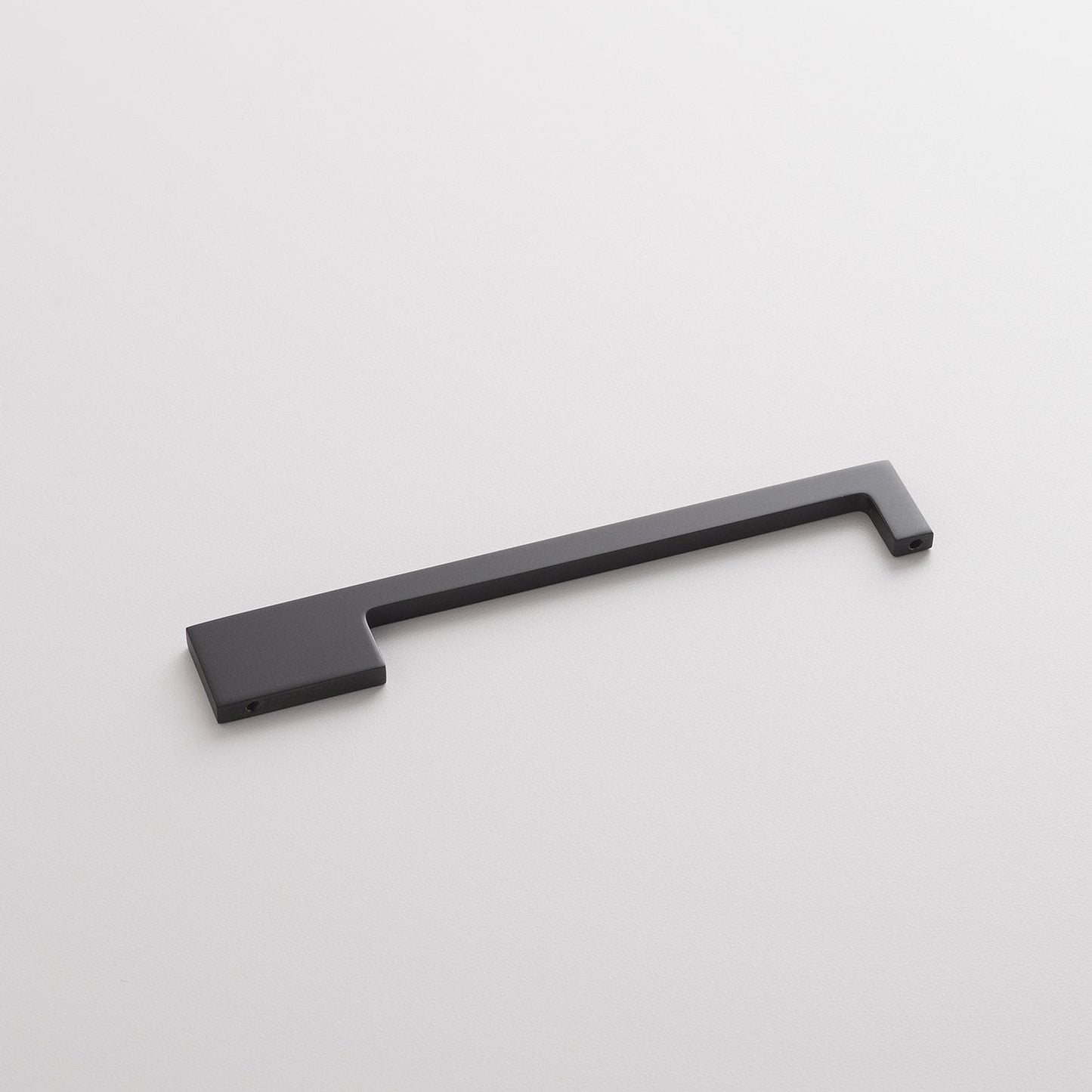 Angled view of the True Black Alberta Pull showcasing its thin asymmetrical profile on a white background