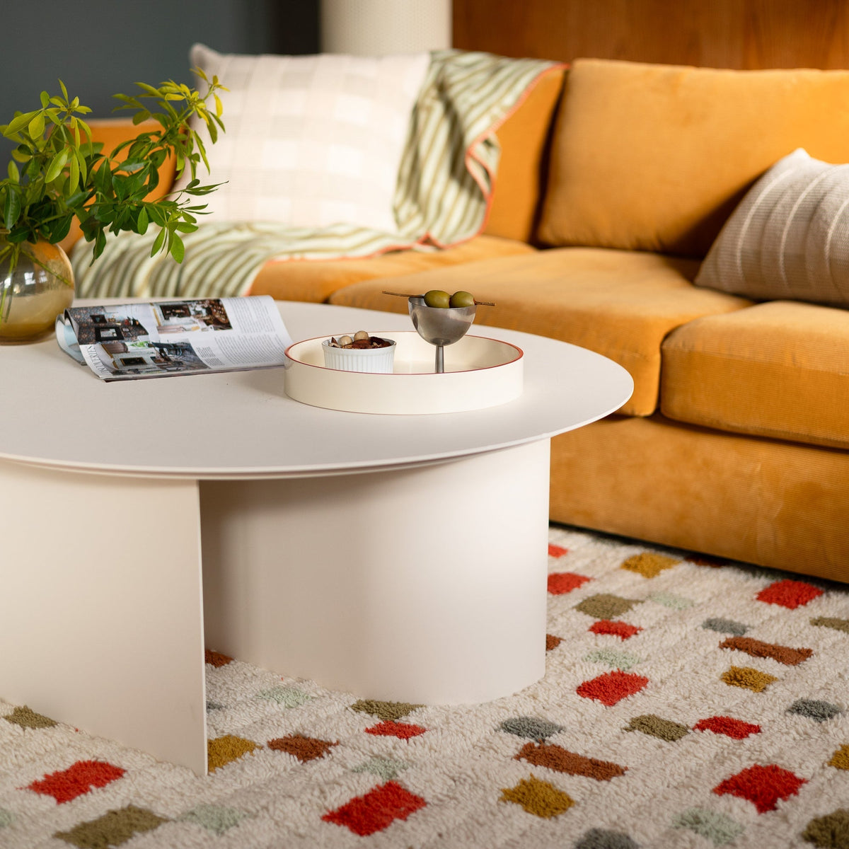 Angled view of Pixel Rug showcasing its plush high pile and colorful geometric pattern beneath a coffee table