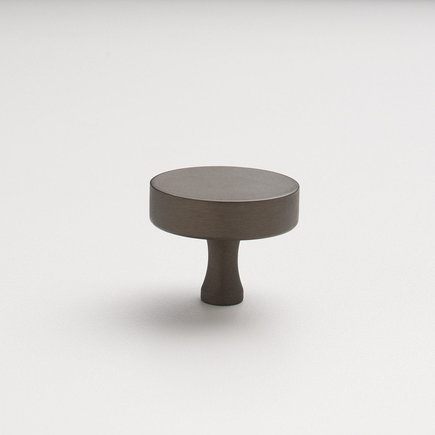 Angled view of Riverwood Knob showcasing its flat finish and fluted neck with a white background