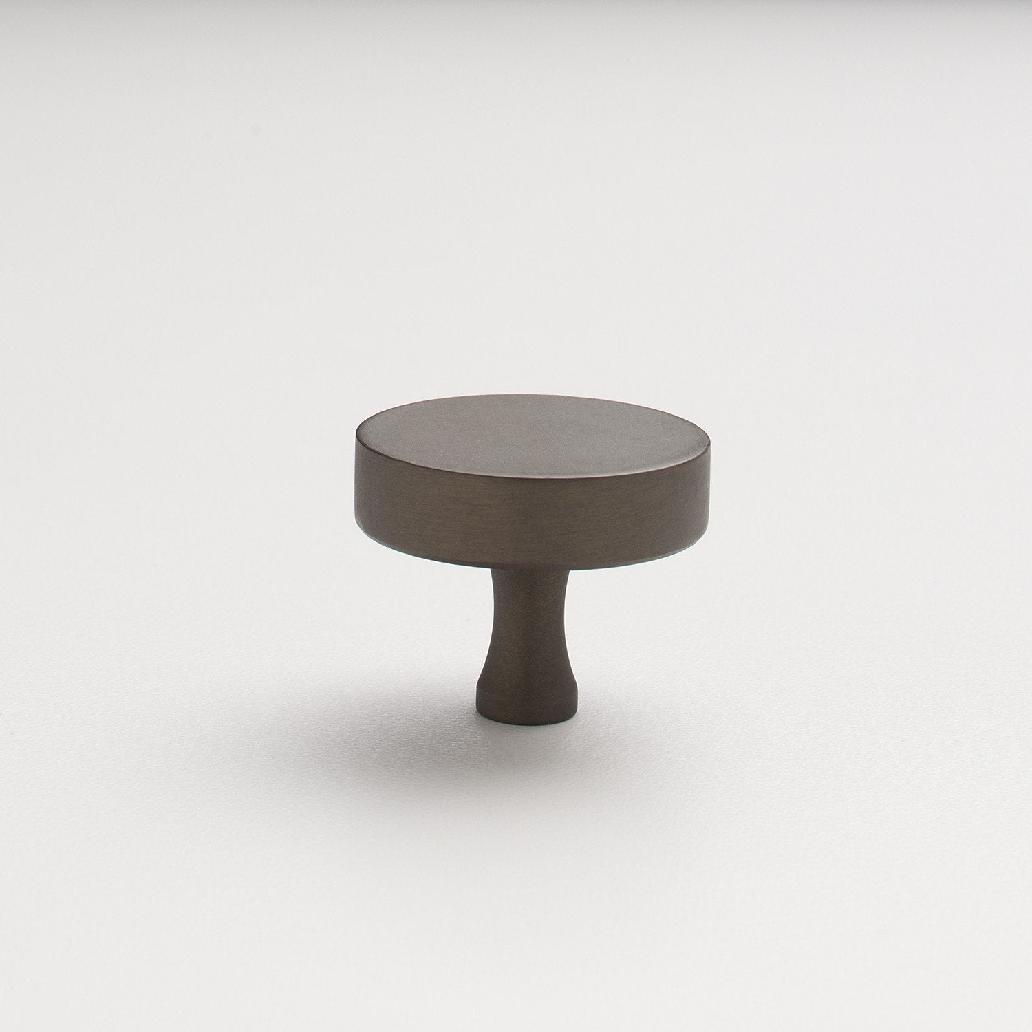 Angled view of Riverwood Knob showcasing its flat finish and fluted neck with a white background