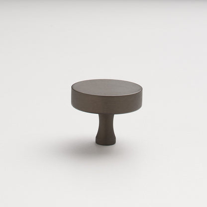 Angled view of Riverwood Knob showcasing its flat finish and fluted neck with a white background