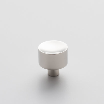Front view of Mid Century Knob showcasing its cylindrical shape with a white finish on a light background