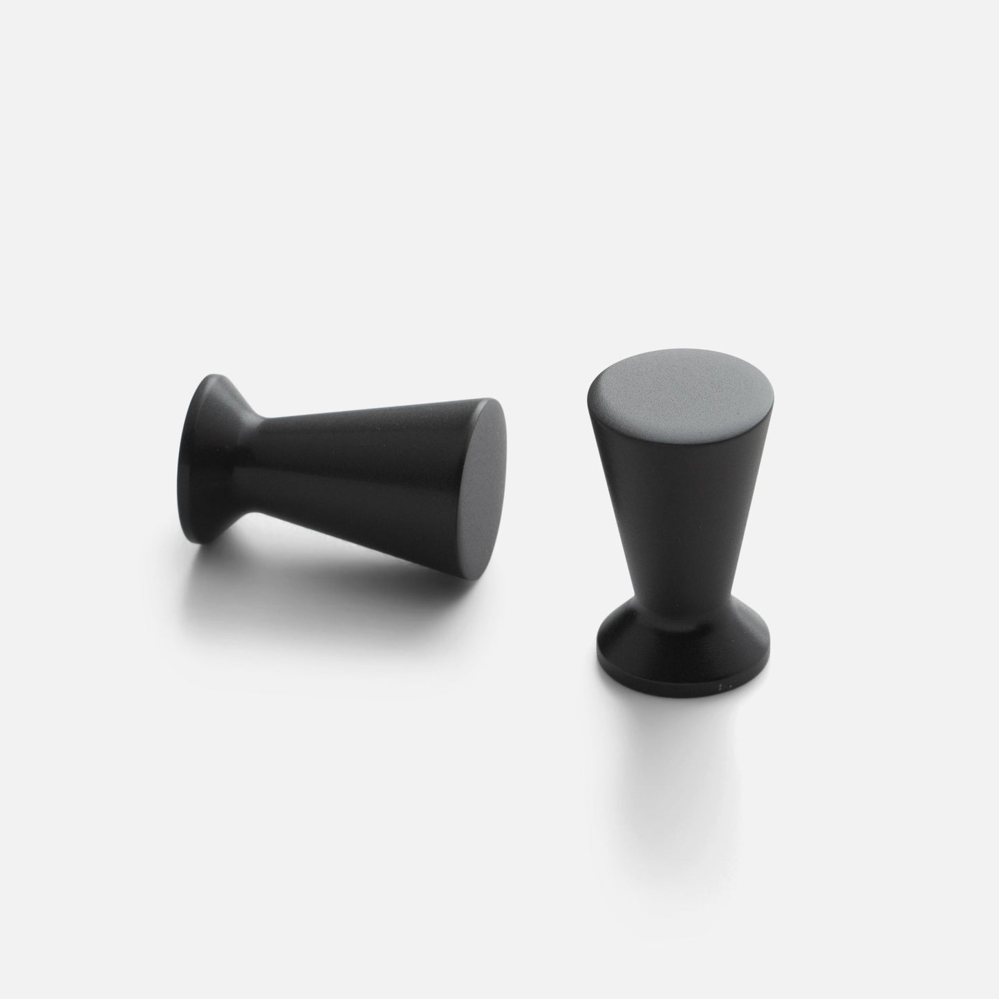Front and side views of the Radcliffe Knob showcasing its True Black color and tapered shape on a white background