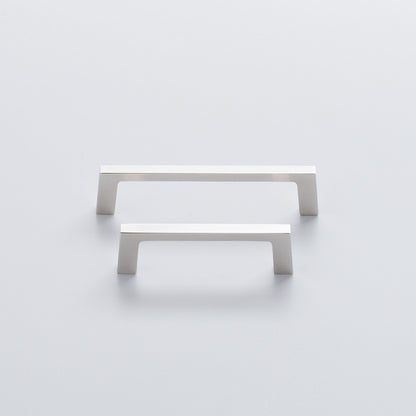 Front view of two Greenwood Pull drawer handles showcasing thin profiles and splayed stems on a light background