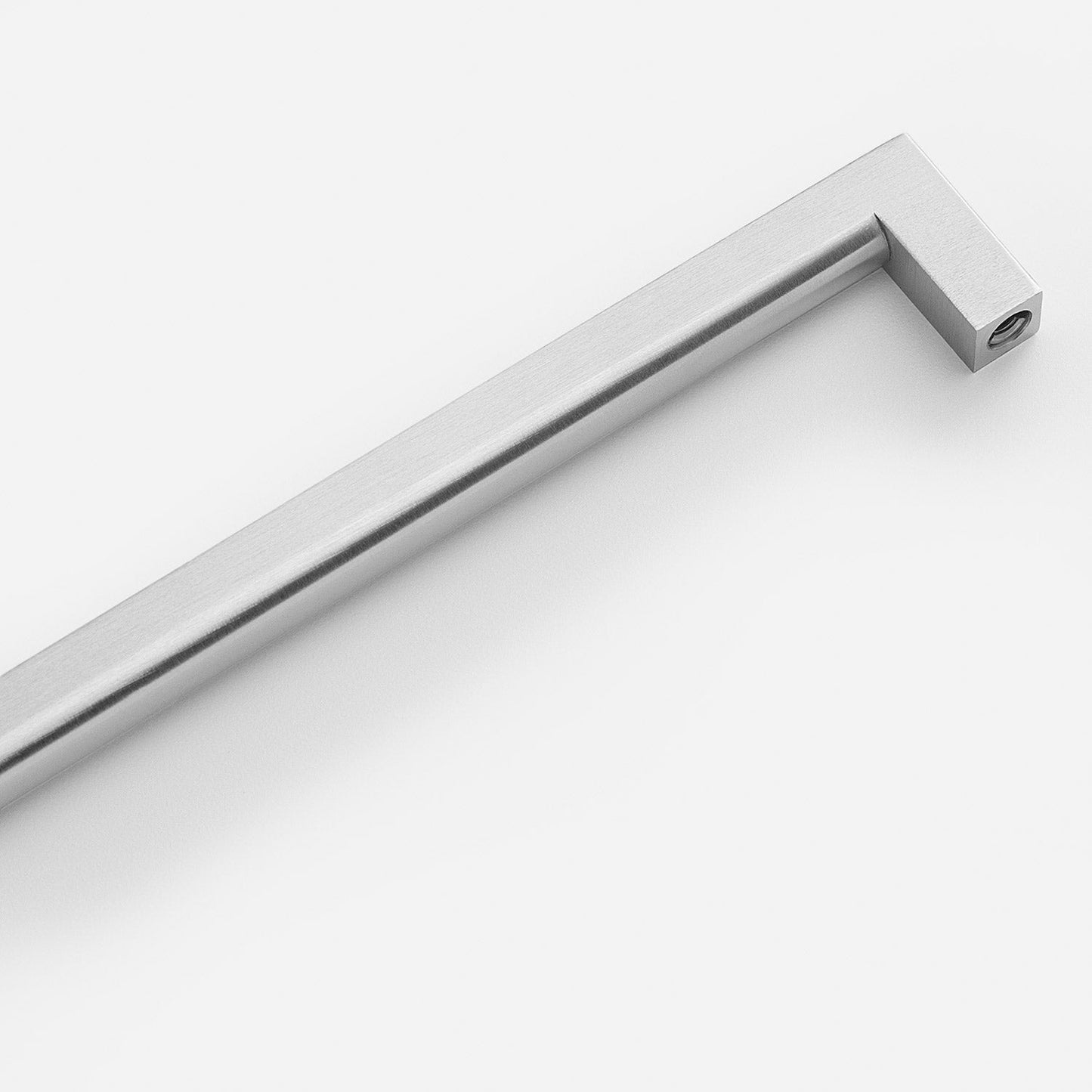 Angled view of Edgecliff Pull showcasing its brushed finish and squared ends on a white background