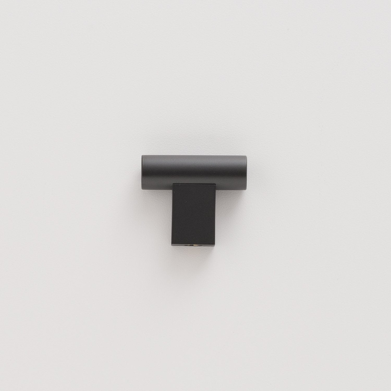 Front view of True Black T Pull showcasing its minimalist solid brass design against a white background