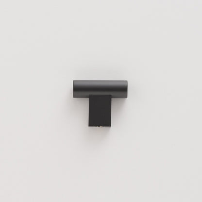 Front view of True Black T Pull showcasing its minimalist solid brass design against a white background
