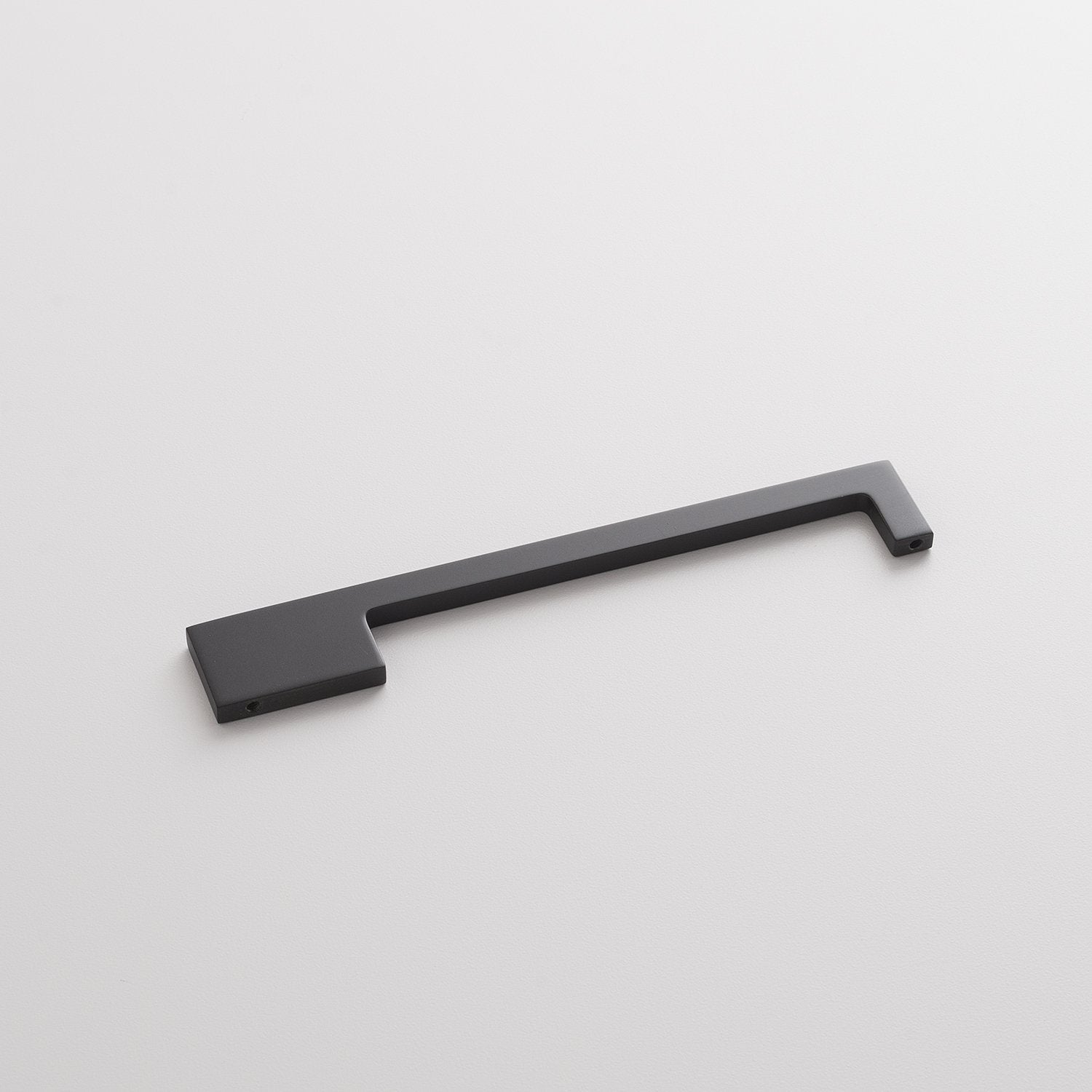 Angled view of the True Black Alberta Pull showcasing its thin asymmetrical profile on a white background