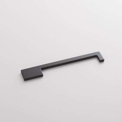 Angled view of the True Black Alberta Pull showcasing its thin asymmetrical profile on a white background