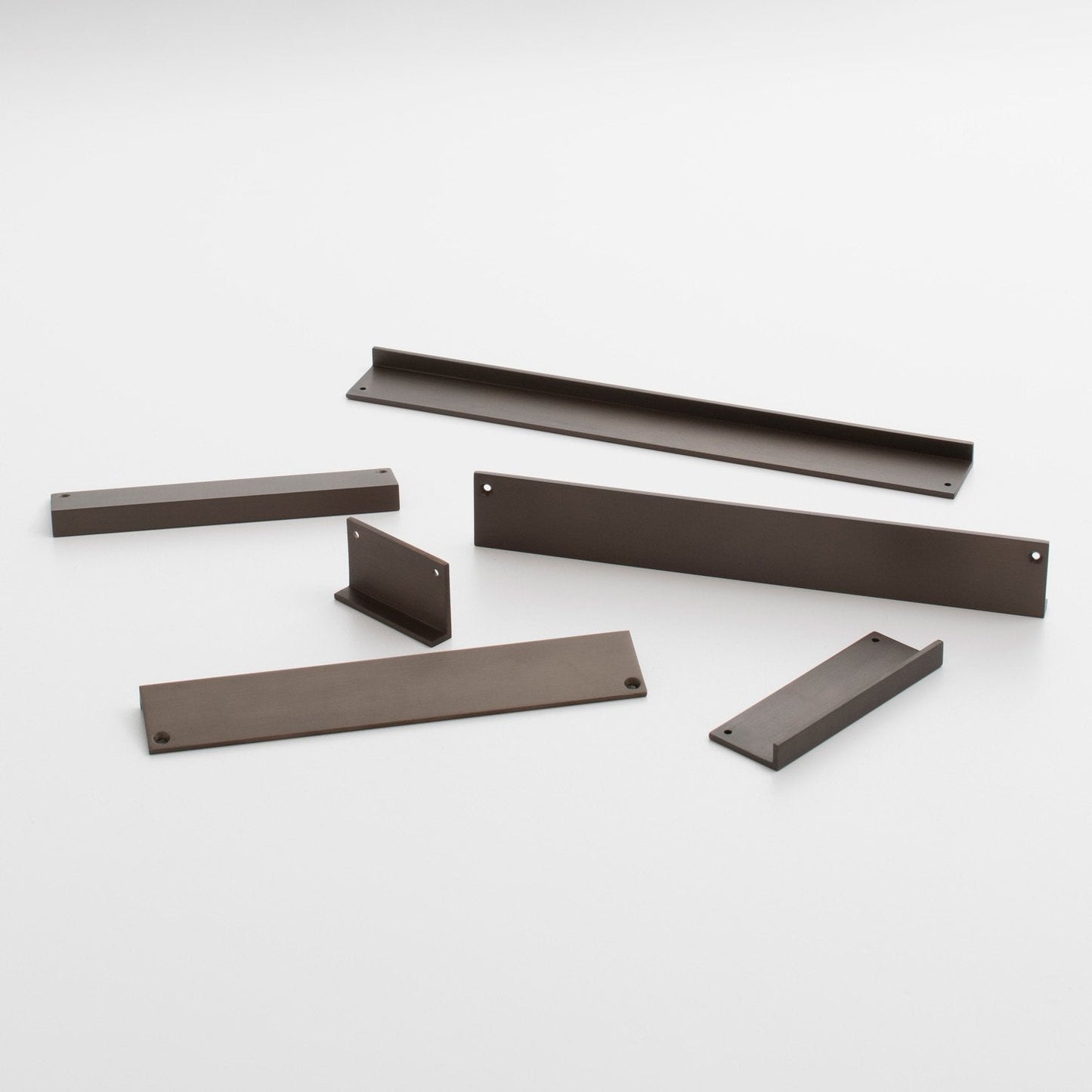 Angled view of Ledge Pull showcasing multiple dark brown components with mounting holes on a white background