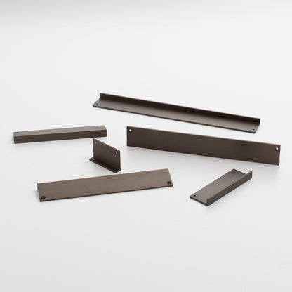 Angled view of Ledge Pull showcasing multiple dark brown components with mounting holes on a white background