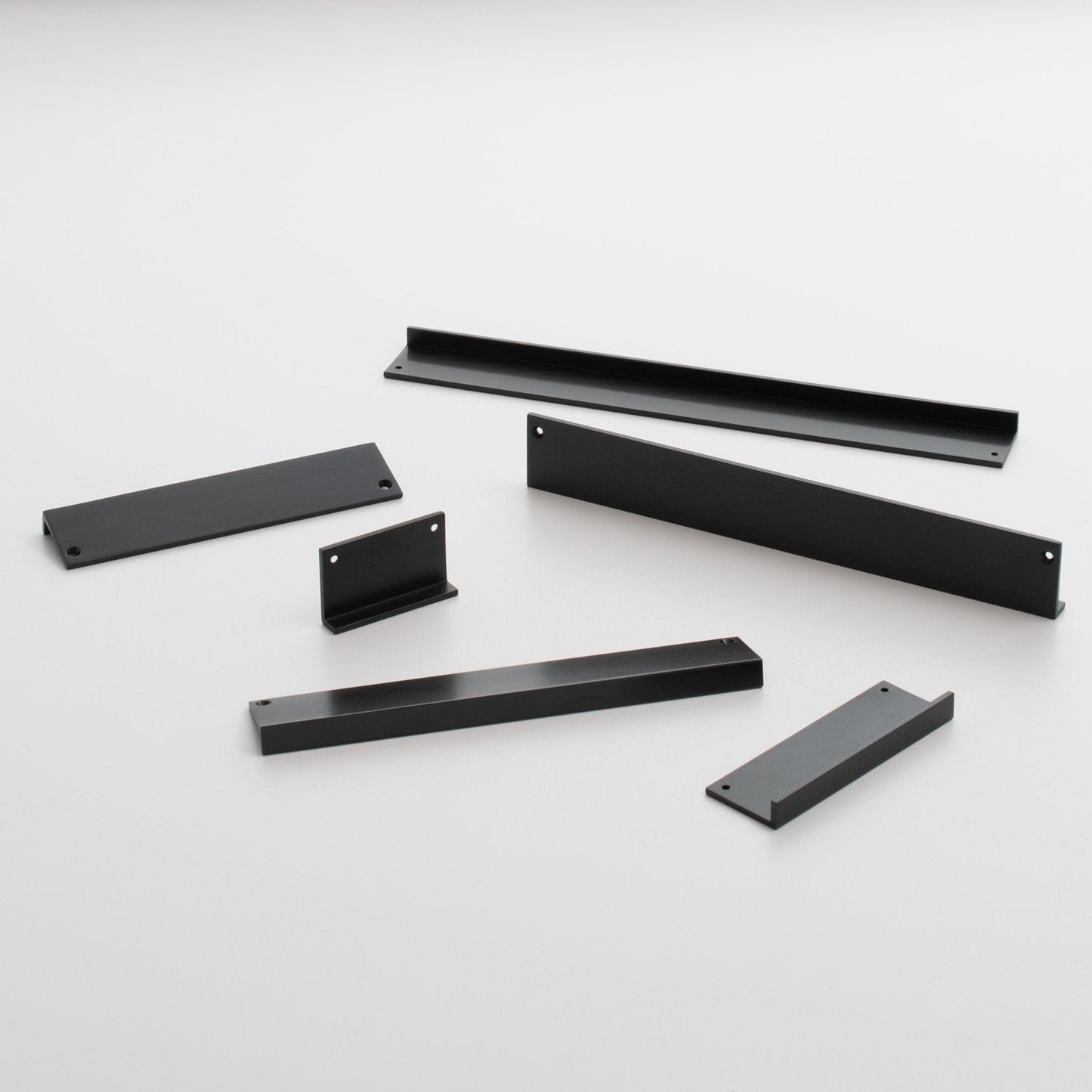 Angled view of Ledge Pull showcasing multiple black pieces with a white background