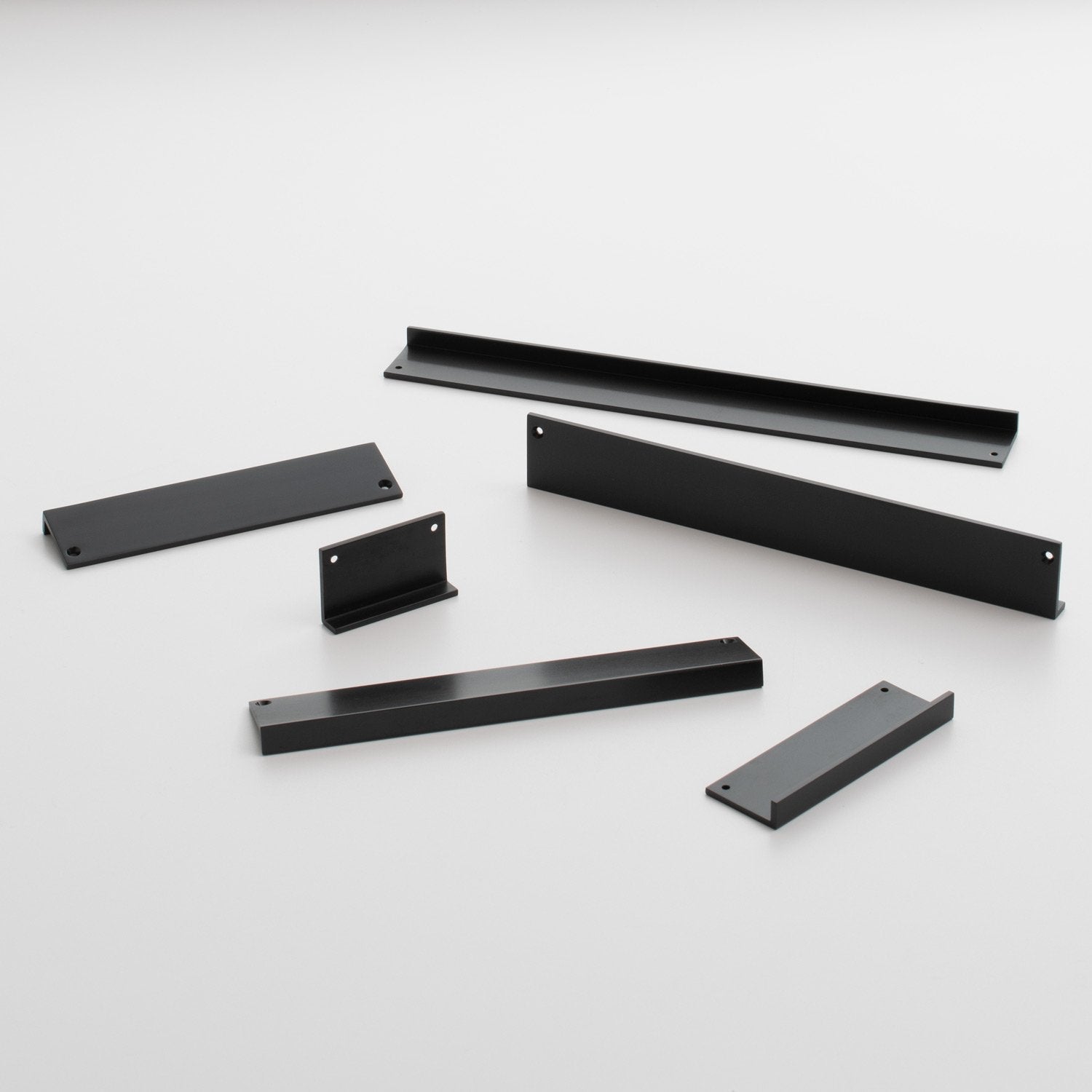 Angled view of Ledge Pull showcasing multiple black pieces with a white background