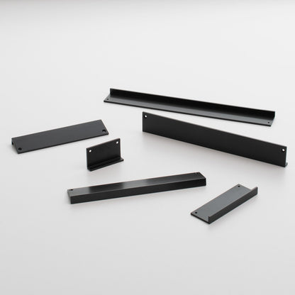Angled view of Ledge Pull showcasing multiple black pieces with a white background