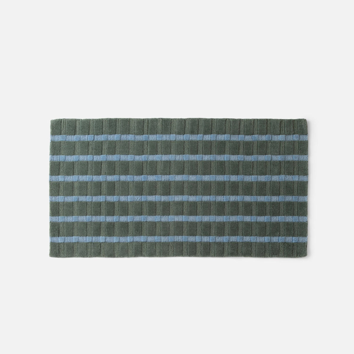 Front view of Ashlar Rug showcasing green-gray texture and horizontal light blue stripes on a light gray background