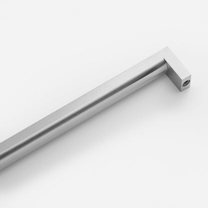 Angled view of Edgecliff Appliance Pull showcasing brushed metal finish and cylindrical handle on a white background