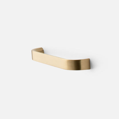 Front three-quarter view of Cascade Pull showcasing its curved brass finish on a white background
