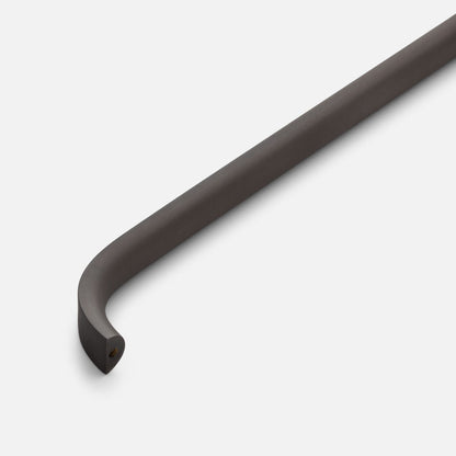 Close-up view of Cascade Pull showcasing its curved bar design on a light gray background