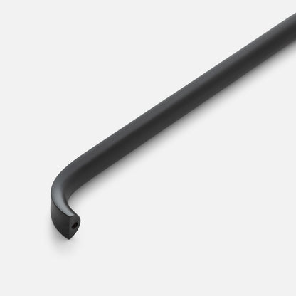 Close-up view of Cascade Pull showcasing its curved black finish with a light gray background
