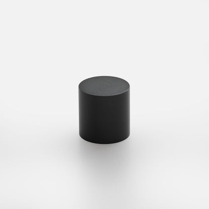 Front view of Cove Knob showcasing its black cylindrical shape with a white background