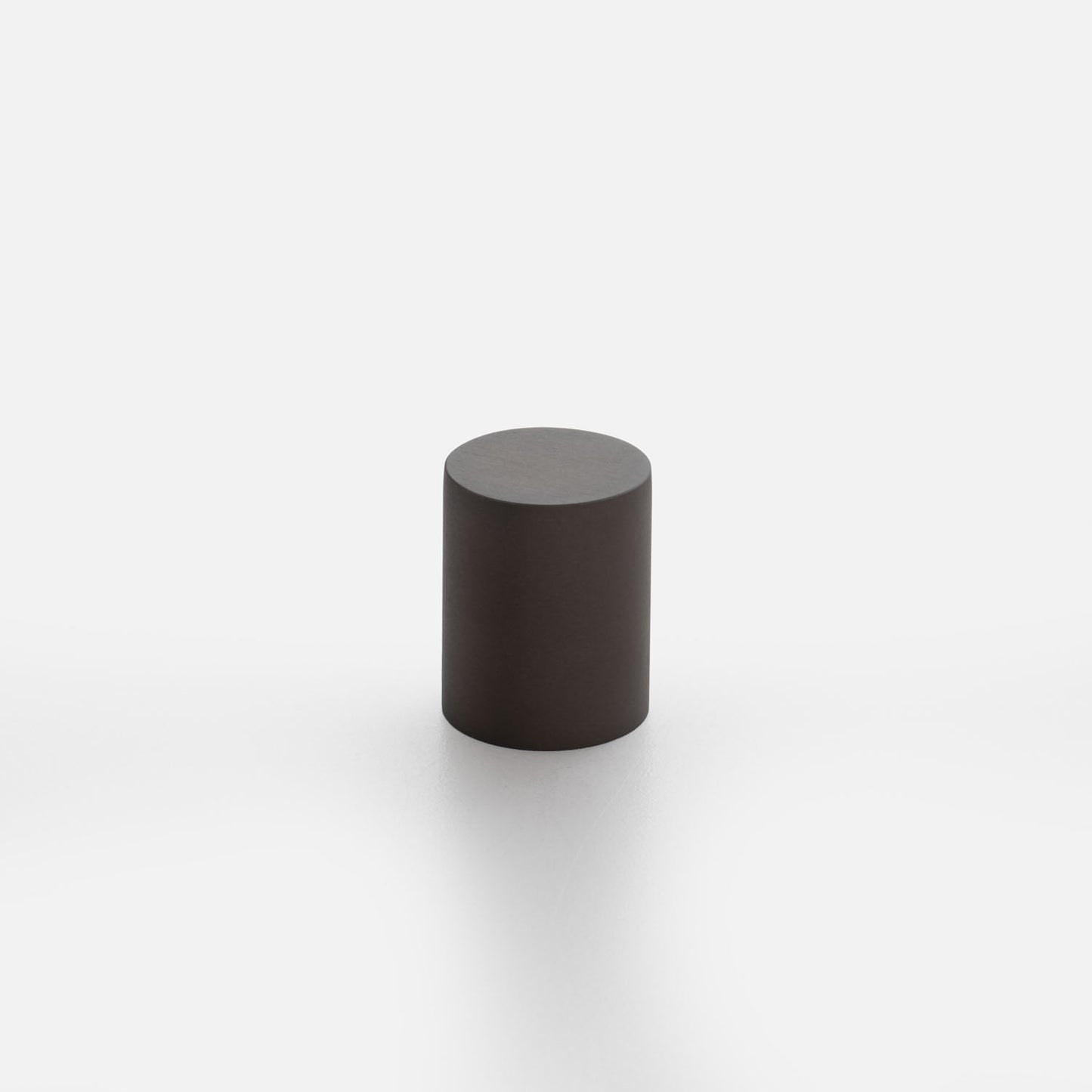 Three-quarter view of Cove knob showcasing its cylindrical shape and flat top with a white background