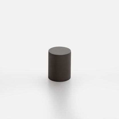 Three-quarter view of Cove knob showcasing its cylindrical shape and flat top with a white background