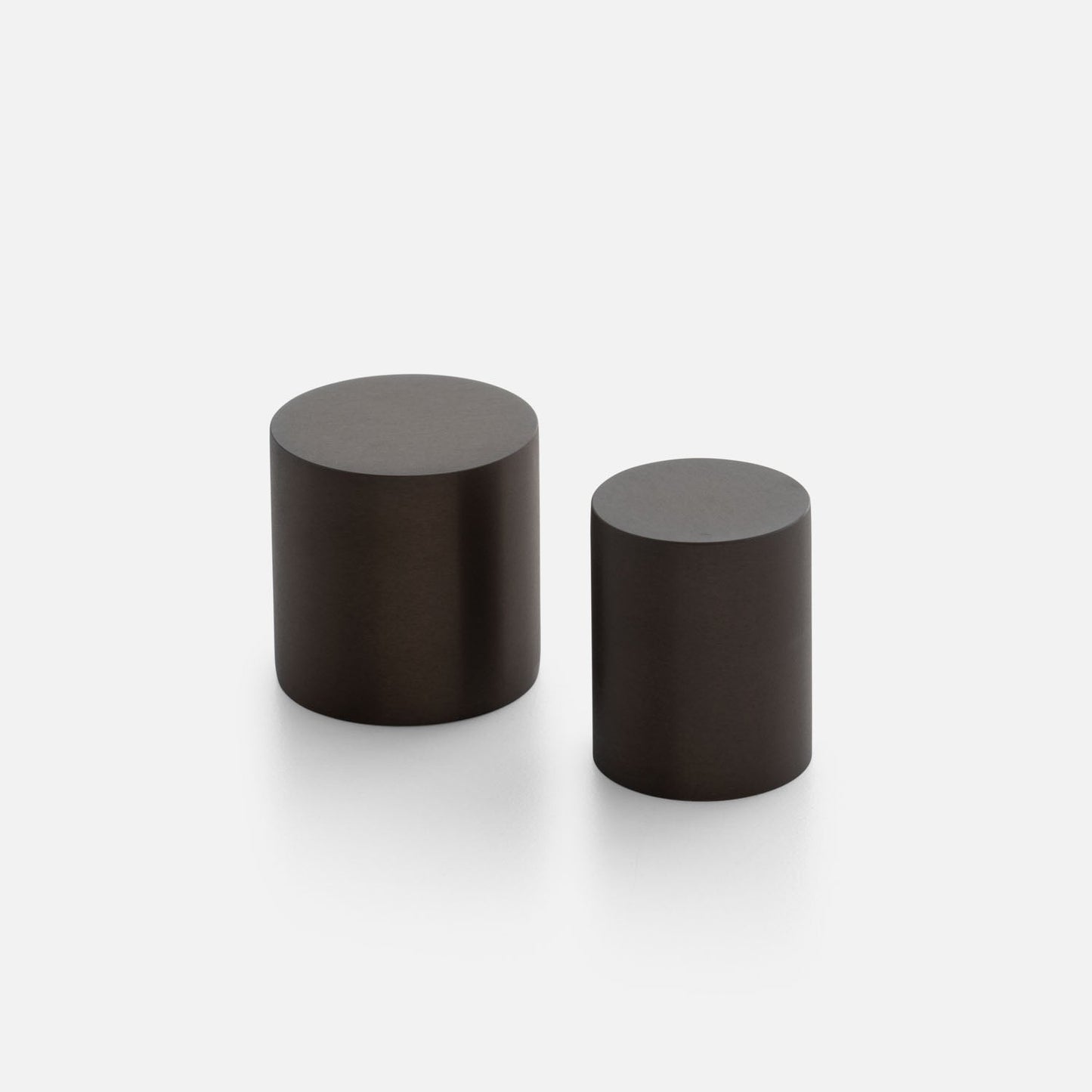 Front view of Cove Knob showcasing two cylindrical knobs on a light background