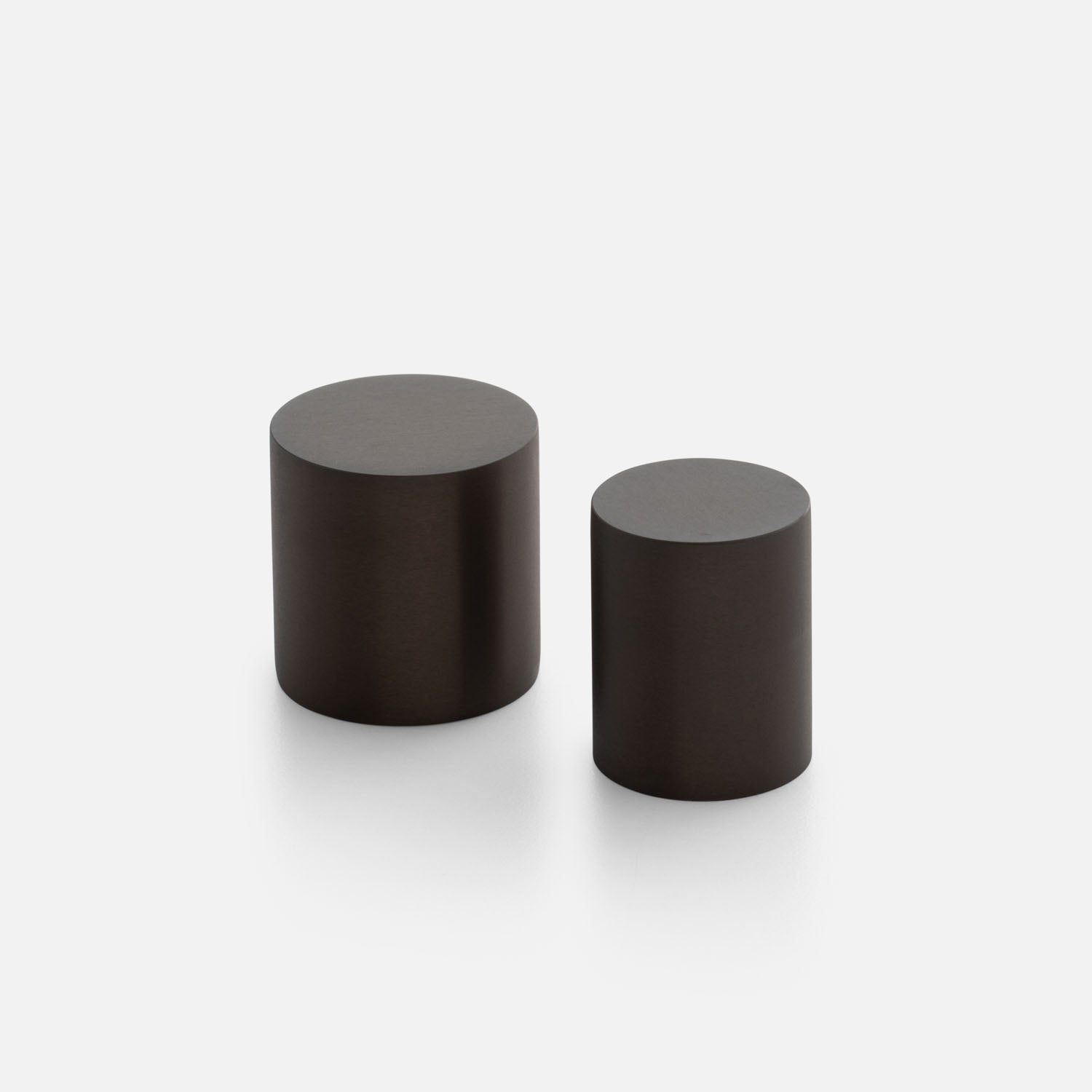 Front view of Cove Knob showcasing two cylindrical knobs on a light background