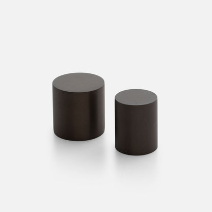 Front view of Cove Knob showcasing two cylindrical knobs on a light background