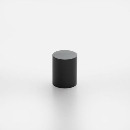 Front view of Cove Knob showcasing its black cylindrical shape against a white background