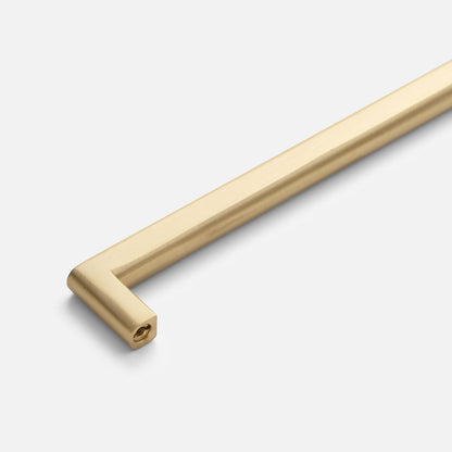 Angled view of Cove Pull showcasing its elongated bar and end-mounted screw hole against a light background
