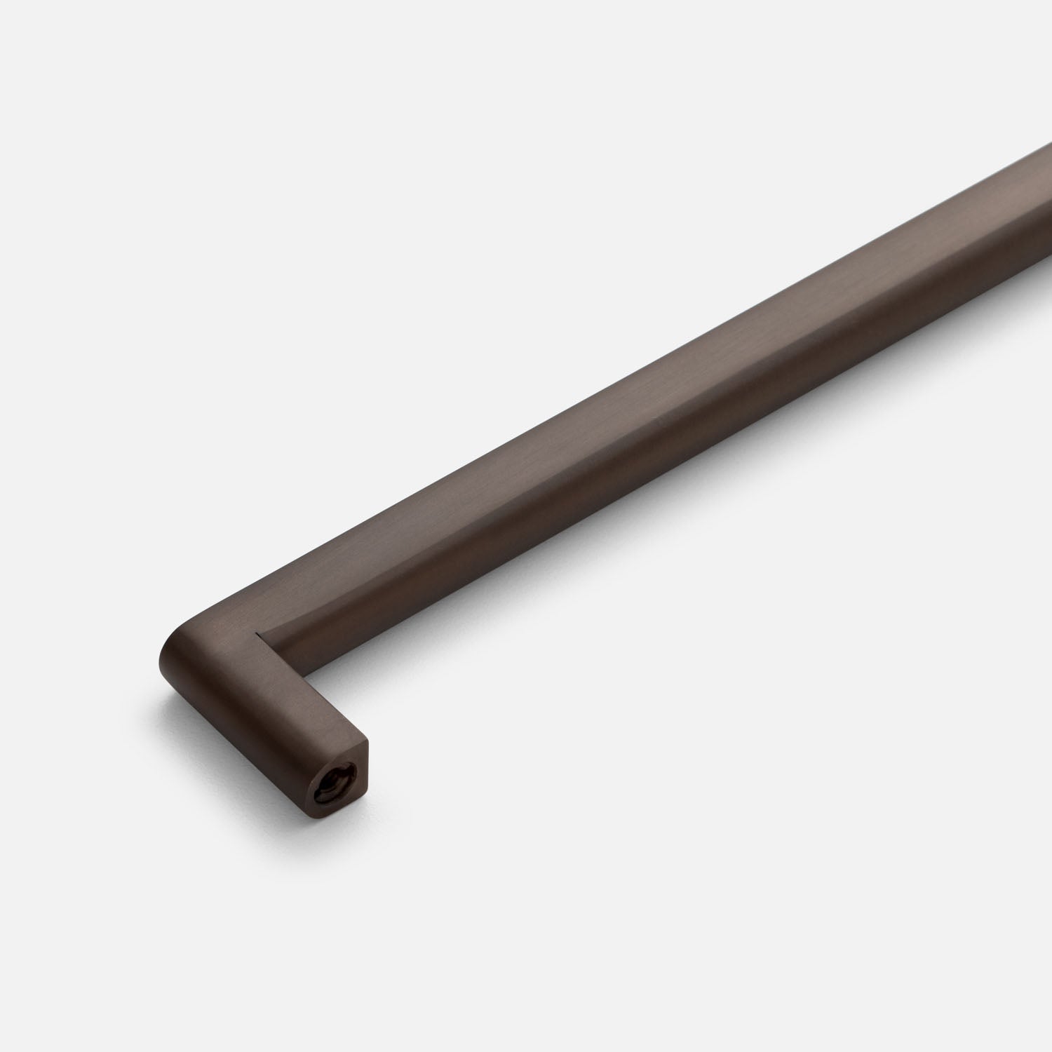Close-up of Cove Pull showcasing its rounded rectangular bar and dark brown finish against a white background