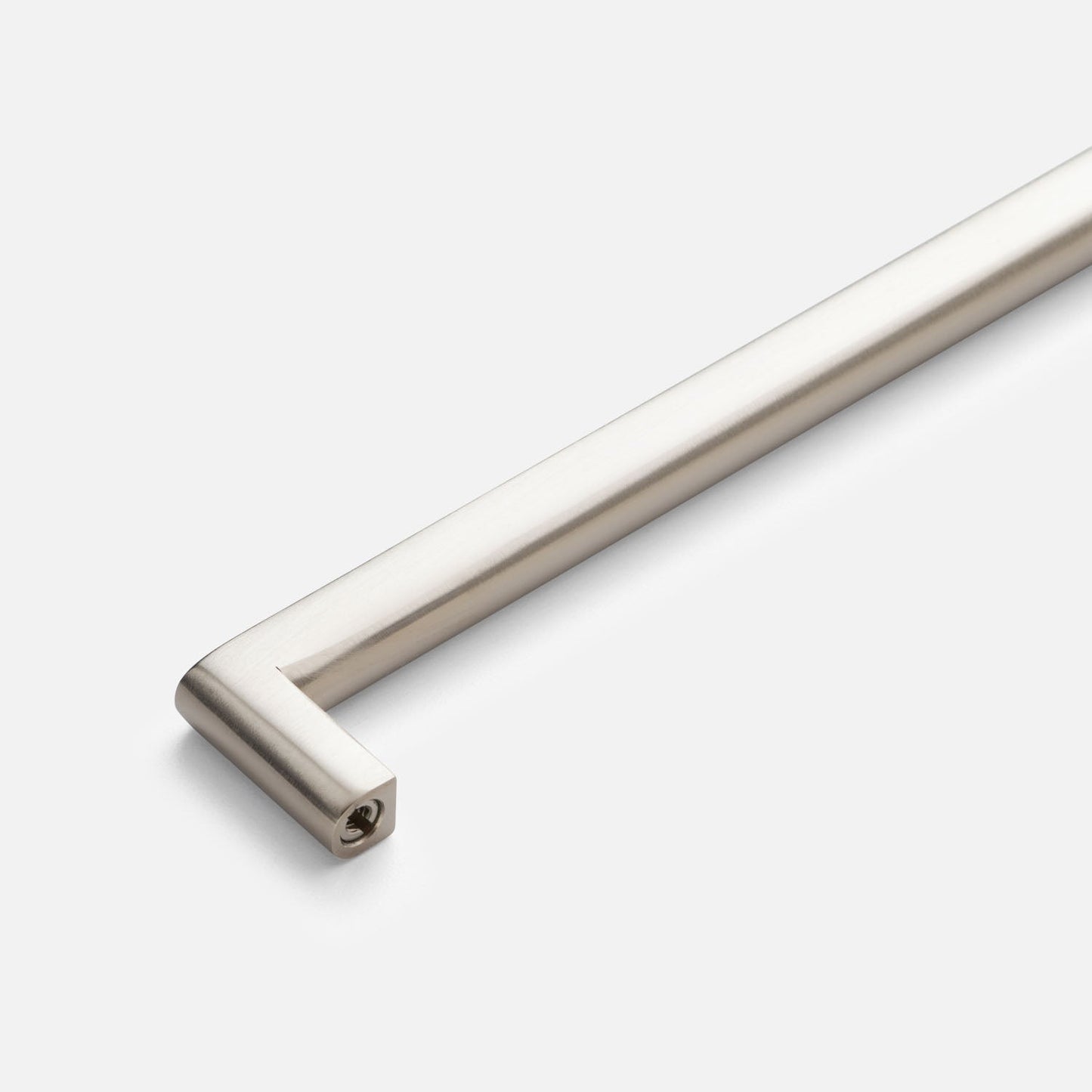 Close-up of Cove Pull showcasing its cylindrical bar and squared mounting end against a light gray background
