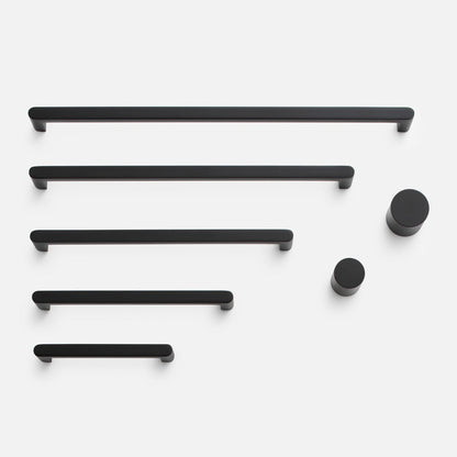 Front view of Cove Pull showcasing black bar pulls and round knobs on a white background