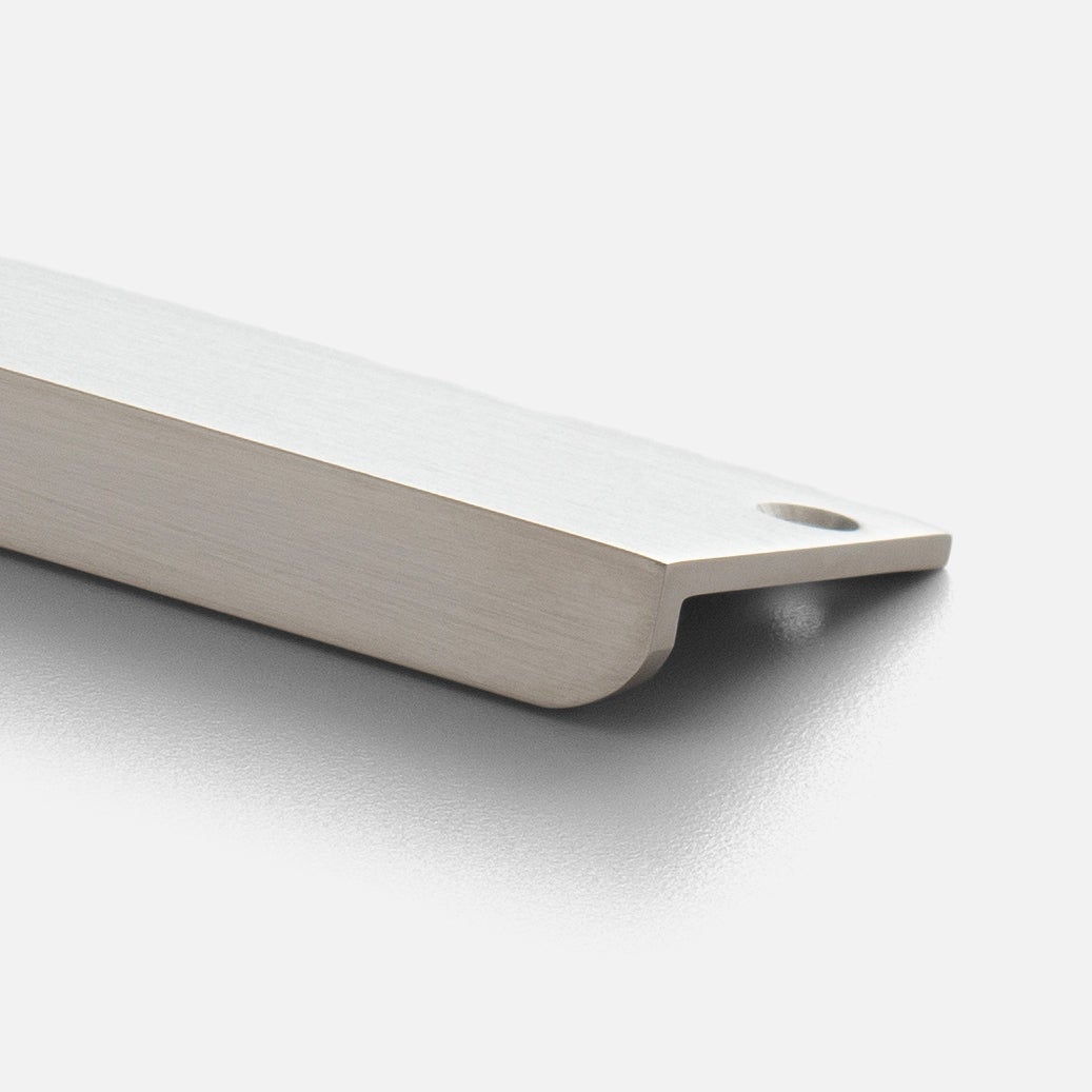 Close-up view of Linn Pull showcasing its tapered end and mounting hole on a light background