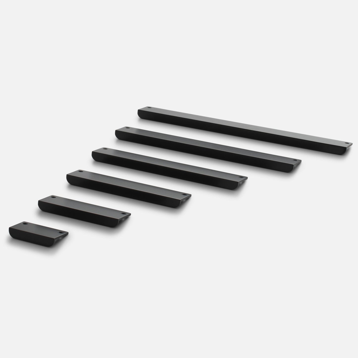 Angled view of Linn Pull cabinet handles showcasing varied lengths, rounded edges, and mounting holes on a white background