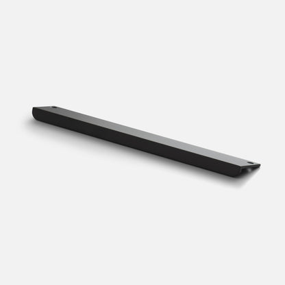 Angled view of Linn Pull showcasing its elongated black bar and two mounting holes on a white background