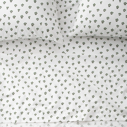 Close-up of Thistle Sheet Set showcasing hand-drawn Alder Green thistle pattern on white fabric