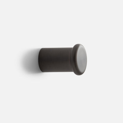 Side view of Remy Single Hook showcasing its cylindrical form and rounded end against a white background