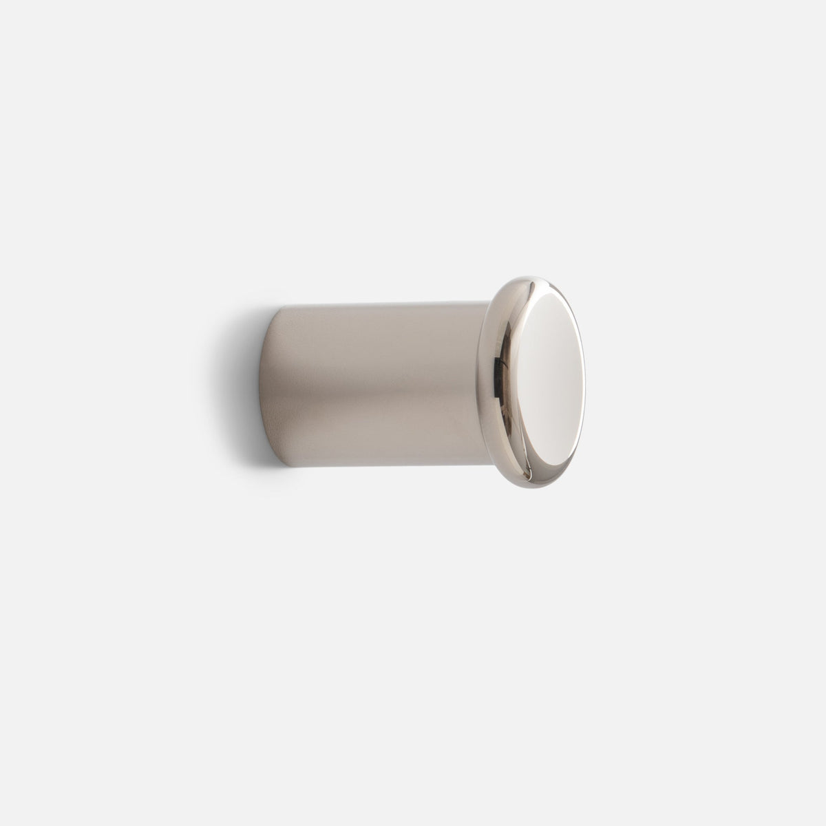Close-up side view of Remy Single Hook showcasing its cylindrical form and round front cap against a white background