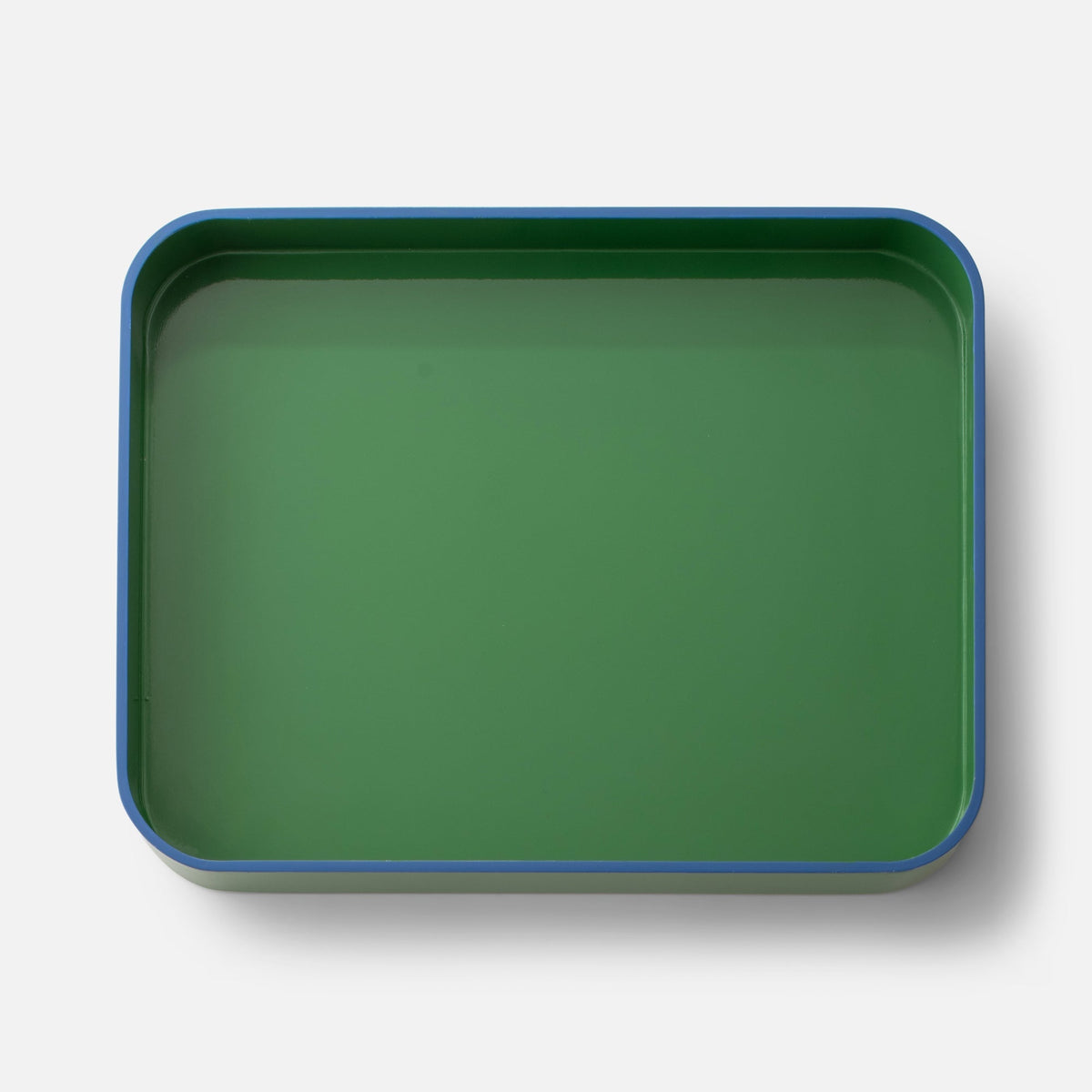 Top view of Clare V Sonia Tray showcasing its green surface and blue rim against a white background