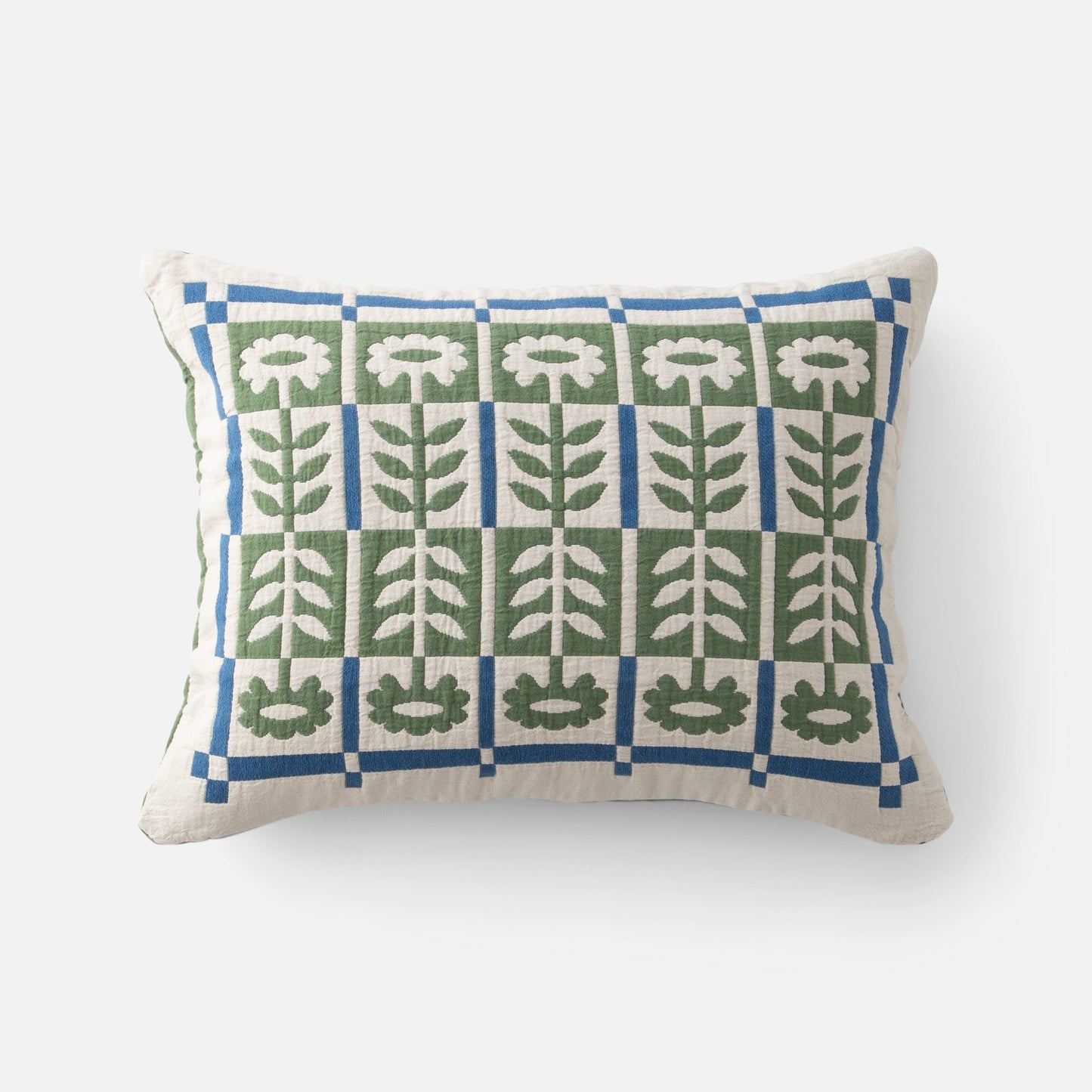 Front view of Stillwater Floral Sham showing green and blue mirrored floral applique grid on cream fabric, white background