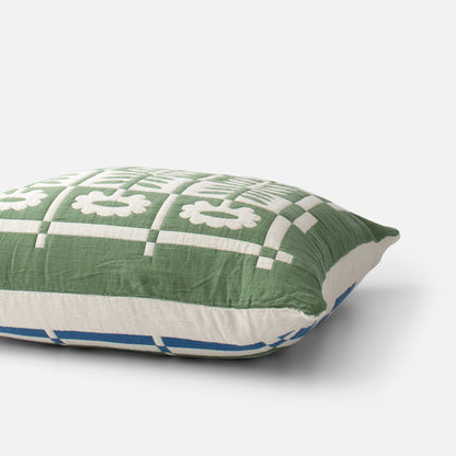 Three-quarter view of Stillwater Sham showcasing a green and cream checked pattern with blue accents on a white background