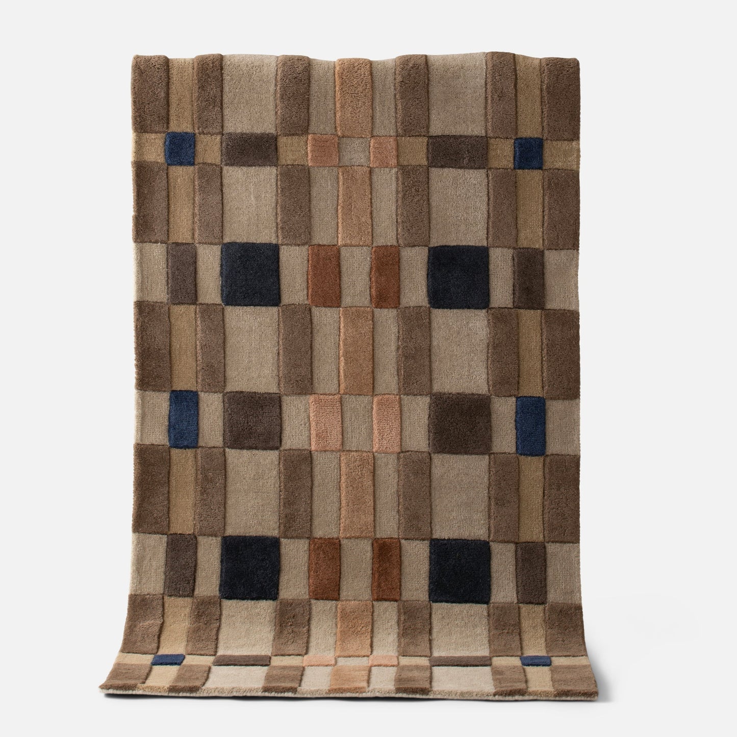 Top view of Campus Wool Rug, recessed pile and plaid-inspired brown grid with navy accent squares on white background