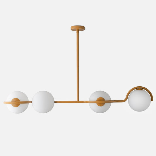 Front view of Aurora Linear light fixture showcasing four white glass globes and brass linear frame on white background