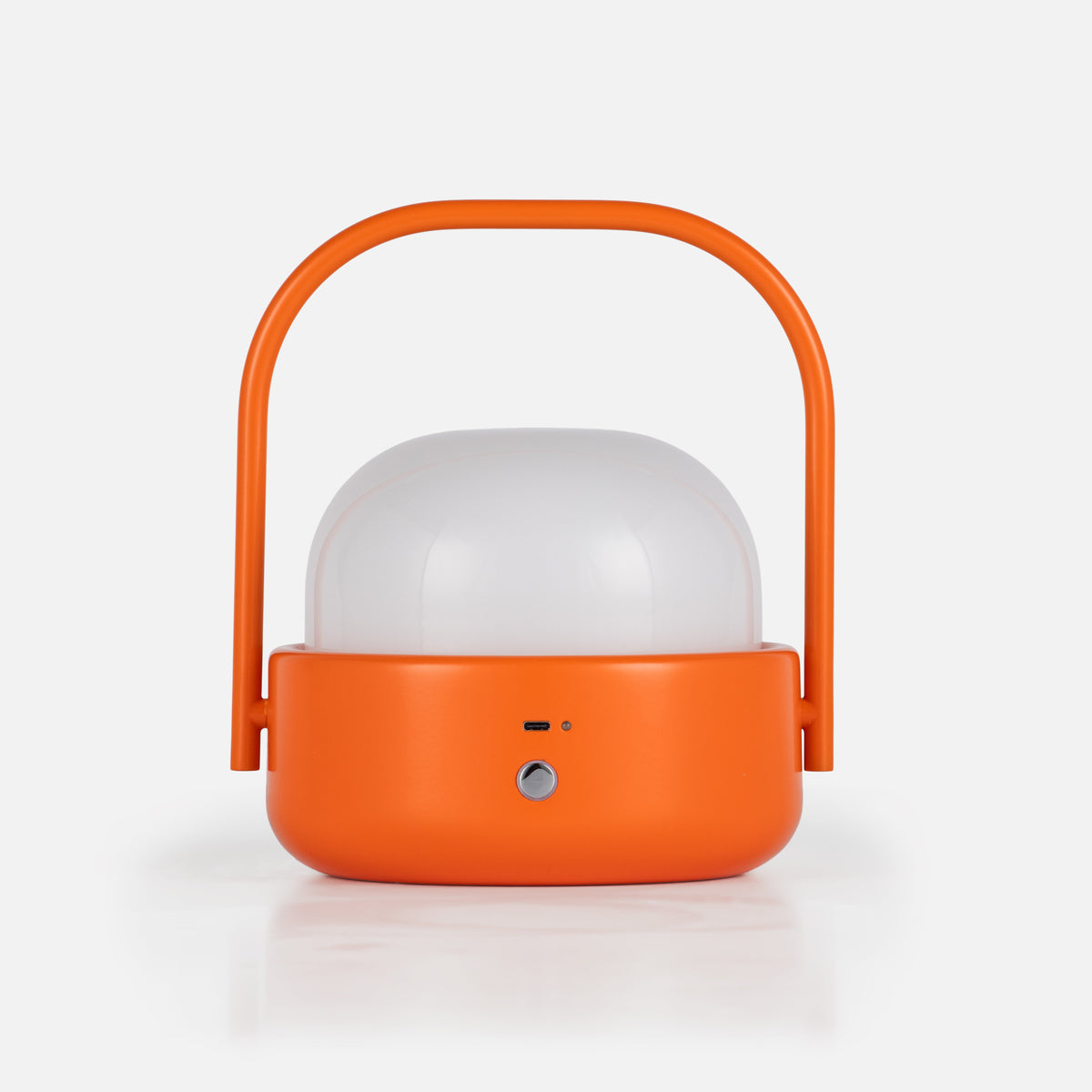 Front view of Cooper table lamp showcasing orange finish, dome shade, and curved handle against a white background
