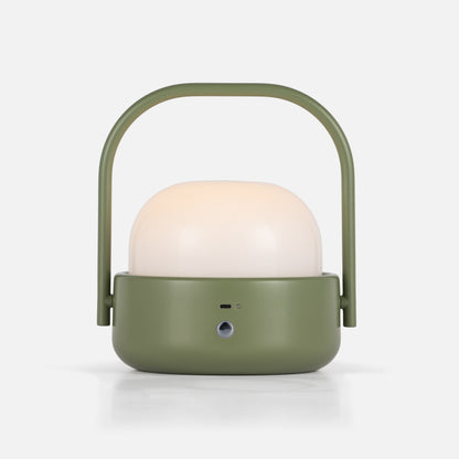 Front view of Cooper table lamp showcasing its olive green body, white dome shade, and arched handle on a white background