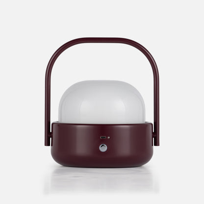 Front view of Cooper Table Lamp showcasing a deep burgundy finish, white diffuser, arched handle, and front controls on a white background