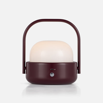 Front view of Cooper Table Lamp showcasing arched handle, white diffuser, and front controls on white background
