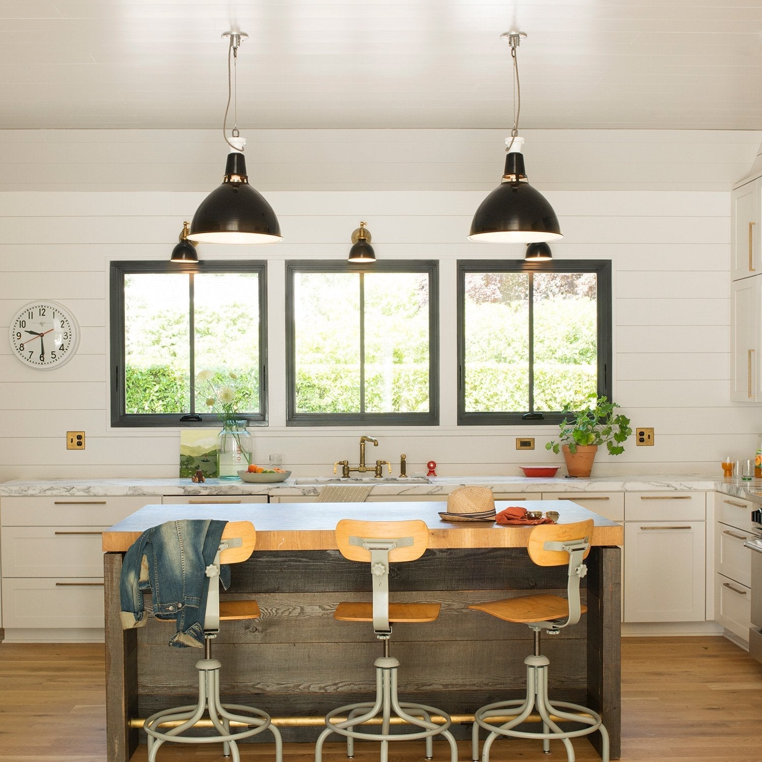 Kitchen featuring Edgecliff Pull cabinet hardware on white cabinetry and a wood island